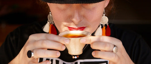 Lady meditating in the morning while drinking tea