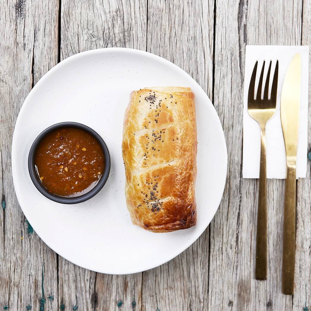 Bruce homemade tomato relish next to sausage roll