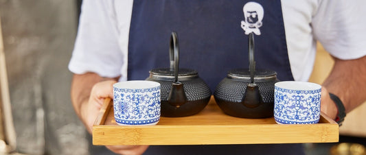 Two cups and two japanese tea kettles