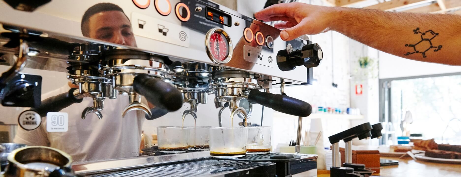 Coffee being made by commercial coffee machine