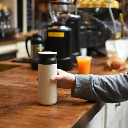 Kinto tumbler 350ml in white on cafe bench